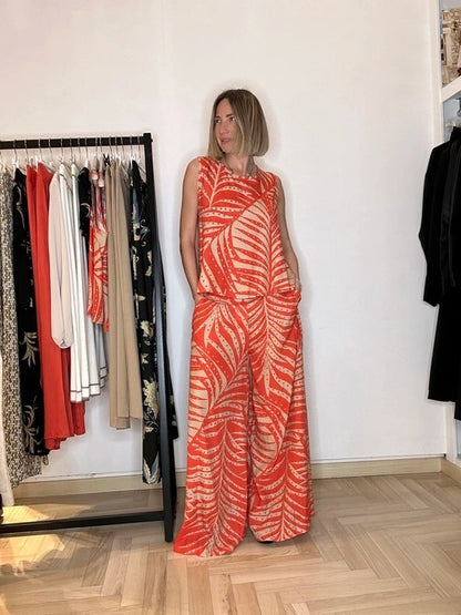 Pantalone a palazzo in viscosa in fantasia tropicale, un capo adatto per una giornata calda a firenze o in ufficio